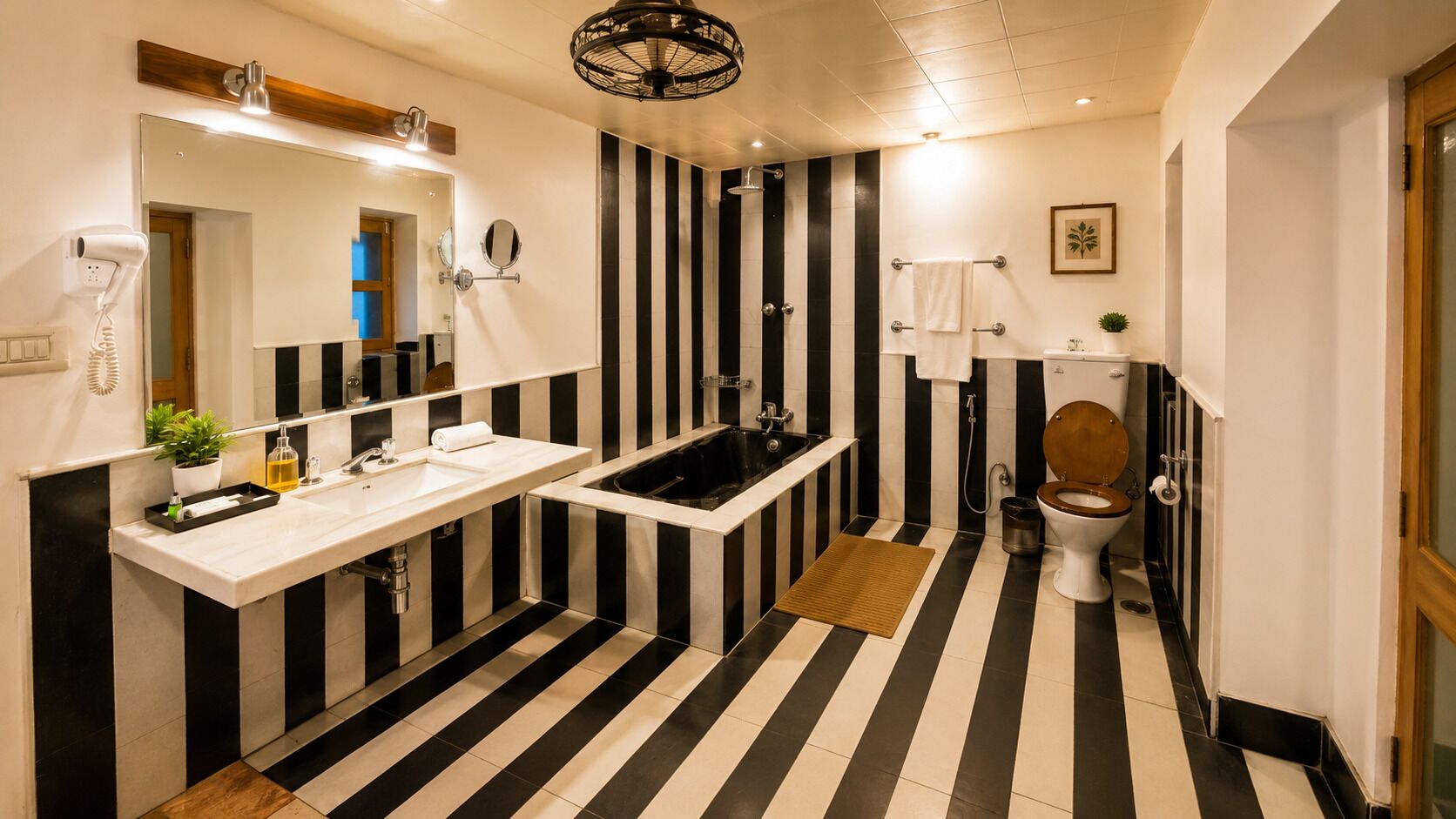 A bathroom with a black and white striped floor, a sink, a bathtub, a toilet, and a mirror.