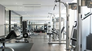 A modern gym with various exercise equipment, glass walls, and a clean, well-lit interior. - InterContinental Shanghai Hongqiao NECC by IHG (Shanghai)