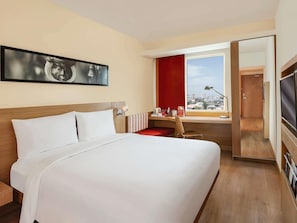 Luxe beddengoed, een minibar, een kluis op de kamer, een bureau