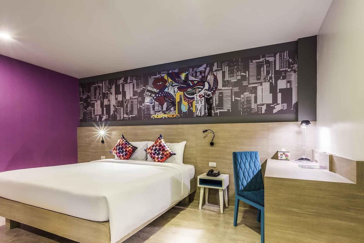 Suite, 1 King Bed with Sofa bed | Minibar, in-room safe, individually decorated, desk