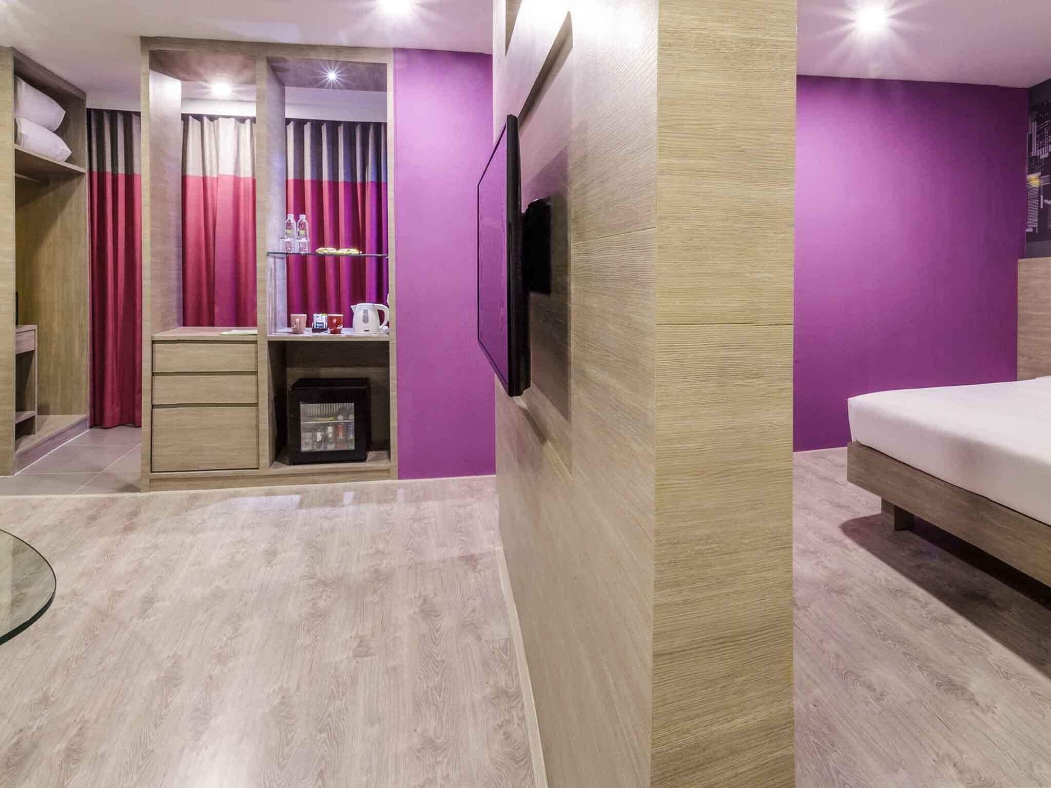 Suite, 1 King Bed with Sofa bed | Minibar, in-room safe, individually decorated, desk