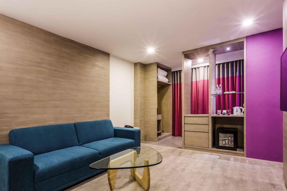 Suite, 1 King Bed with Sofa bed | Minibar, in-room safe, individually decorated, desk