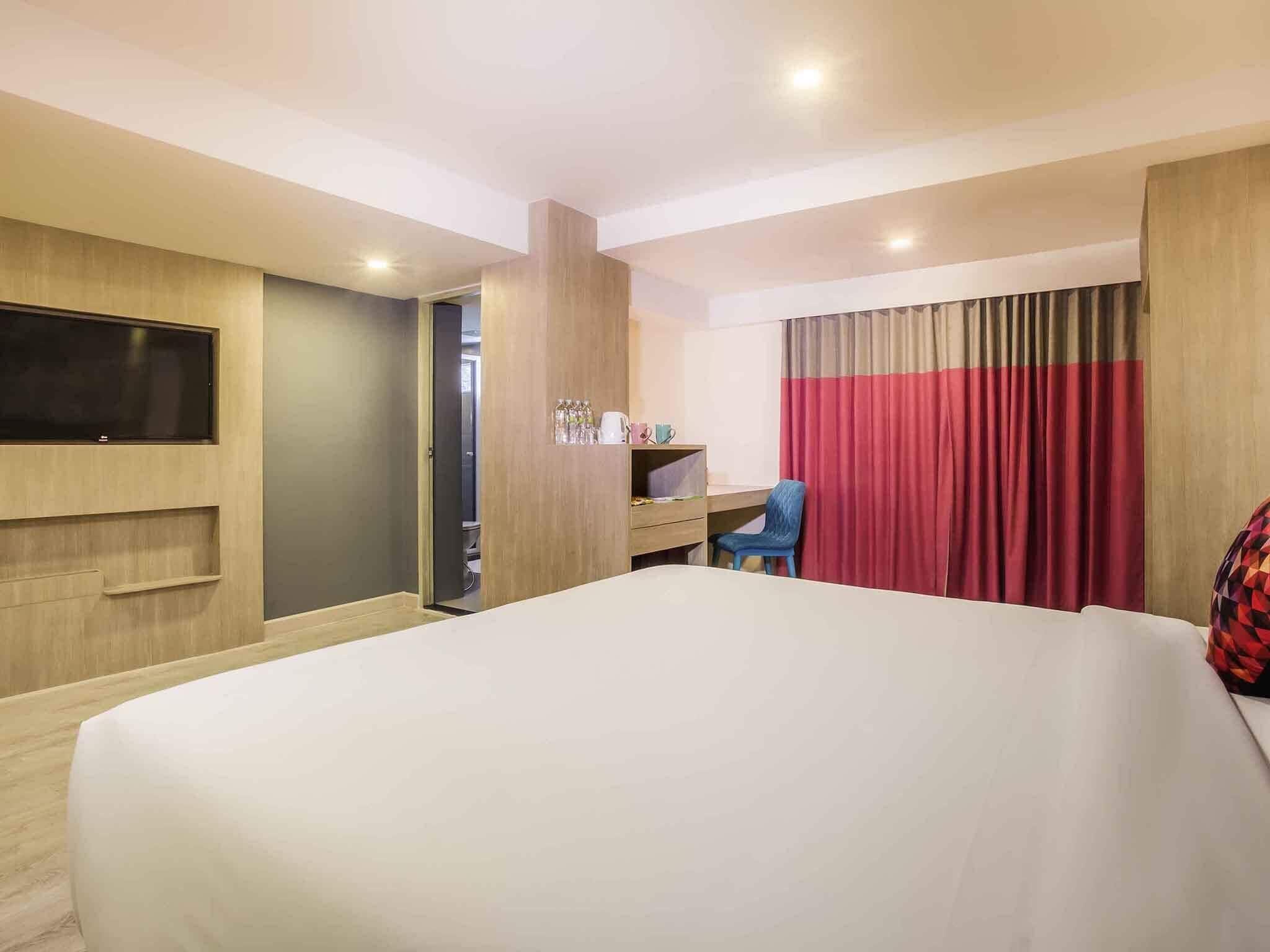Family Room, Multiple Beds | Minibar, in-room safe, individually decorated, desk