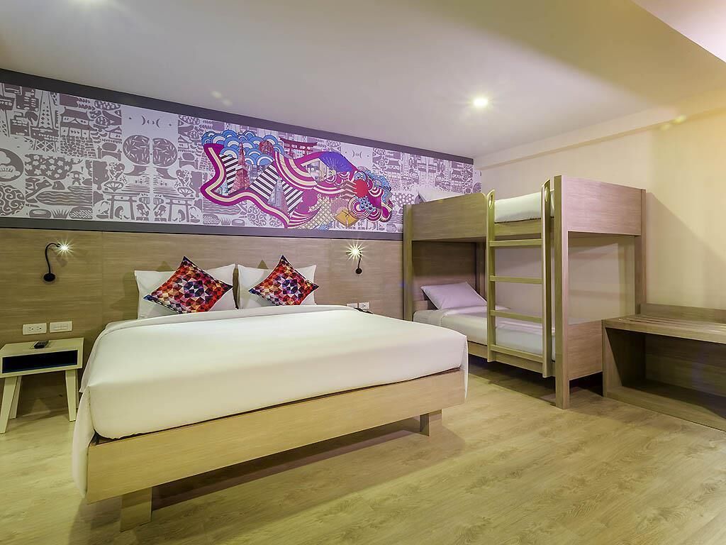 Family Room, Multiple Beds | Minibar, in-room safe, individually decorated, desk