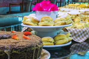 Indulge in a selection of sweet treats, including a decadent chocolate cake with fresh strawberries.