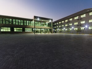 Stunning courtyard with a mix of glass and concrete architecture.