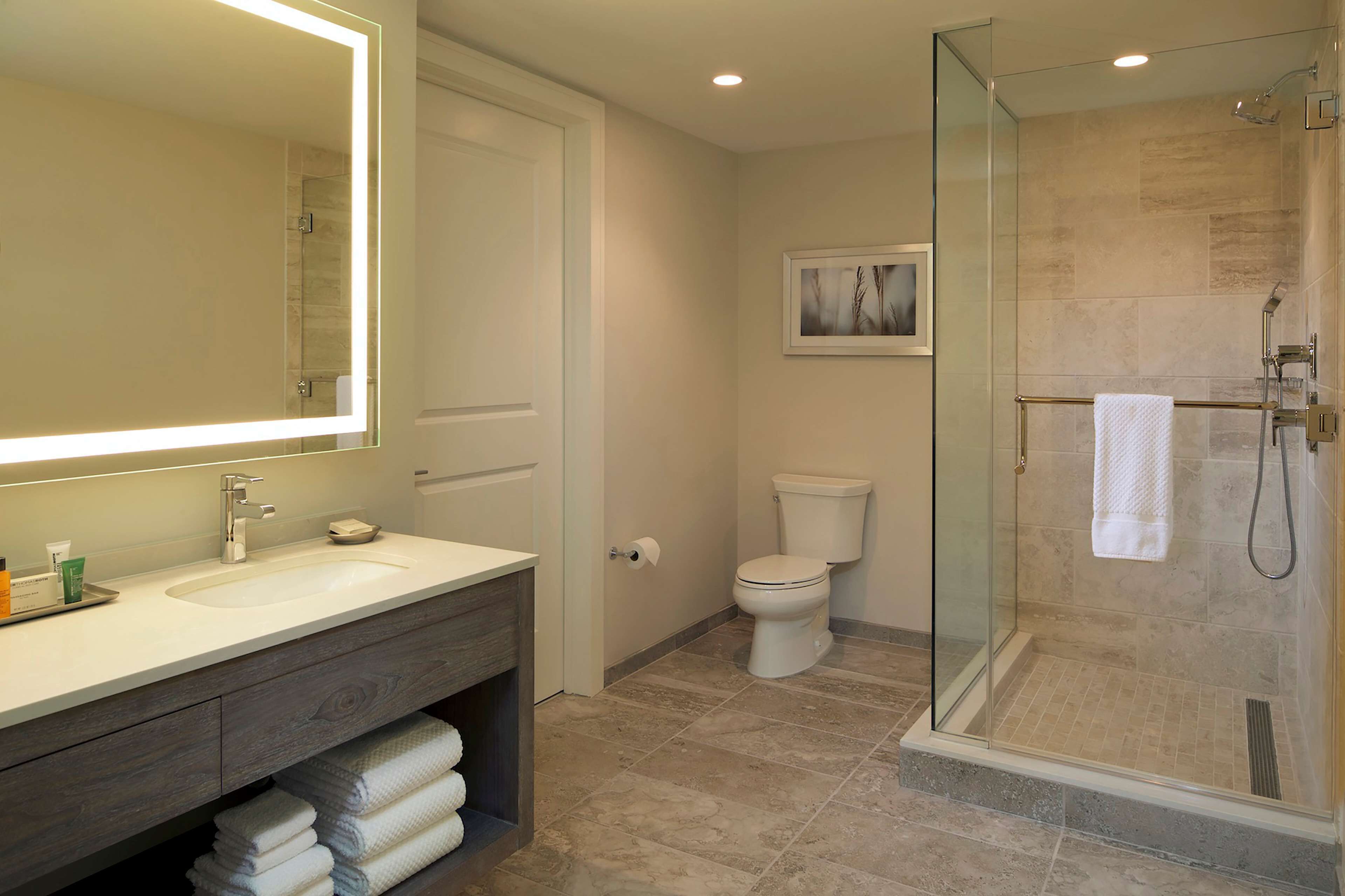 separate bathtub and shower, deep-soaking bathtub, designer toiletries