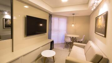 Luxury Studio Suite, 1 Bedroom, Lanai | Living area | 32-inch flat-screen TV with cable channels, TV