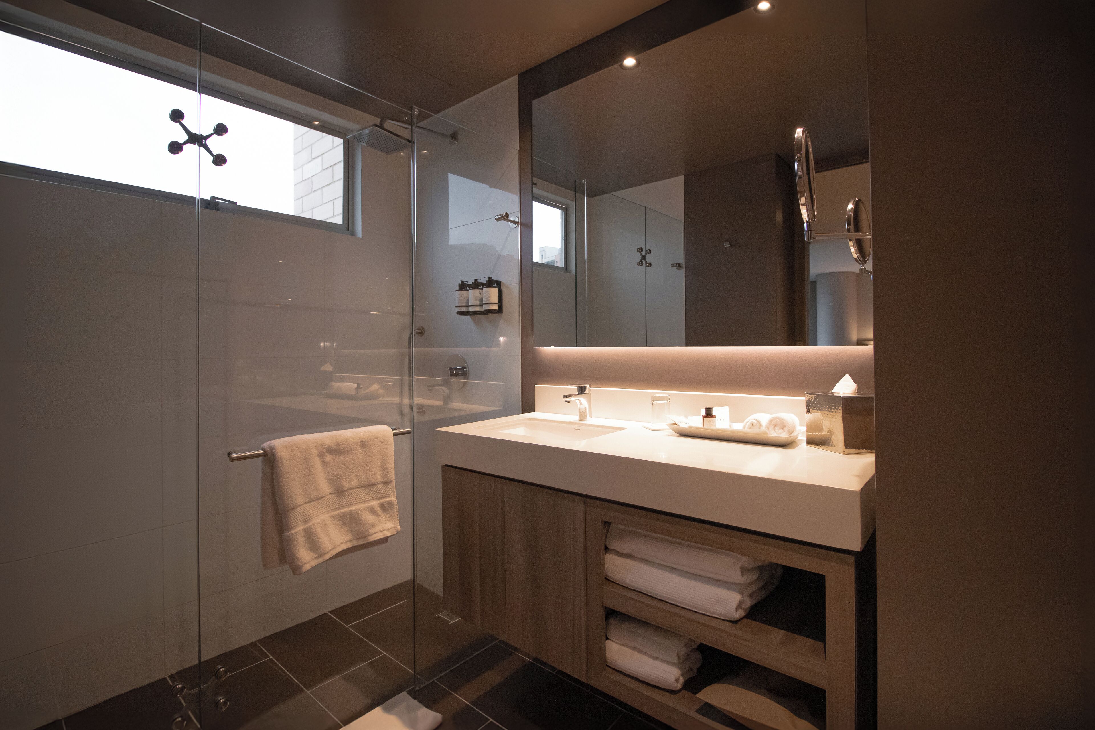 designer toiletries, hair dryer, towels, soap