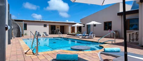 Outdoor pool, pool umbrellas, pool loungers