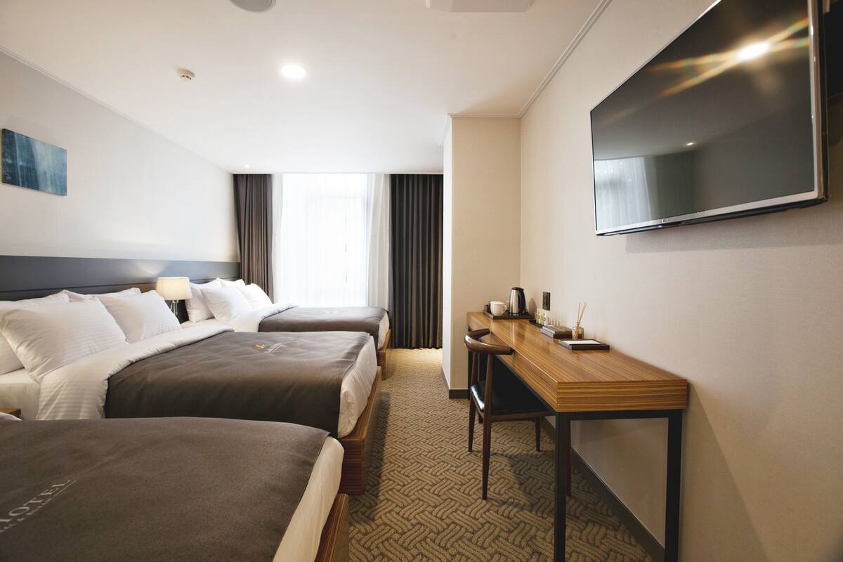Family Triple Room | Premium bedding, in-room safe, desk, blackout drapes