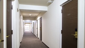 A hotel corridor with doors numbered 1010 and 1031.
