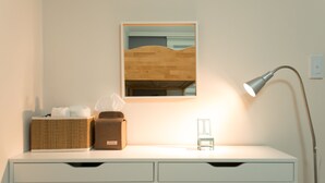 A white desk with a mirror, a lamp, a tissue box, and a small chair. - The Blossom Yeonnam Guesthouse (Seoul)