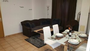 Apartment, 1 Bedroom | Living room | LED TV, fireplace