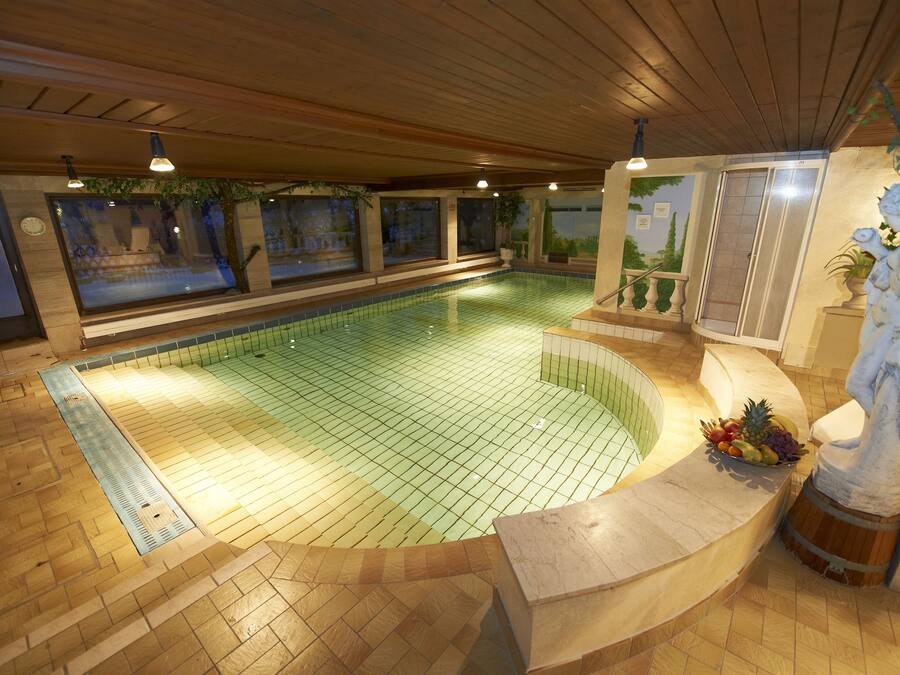 Indoor pool, open 7:00 AM to 8:00 PM, pool loungers