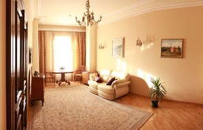 Luxury Suite, 1 Bedroom, Balcony | Living area | Flat-screen TV - British Club Lviv (Lviv)
