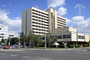 A hotel with a modern architectural design, featuring a prominent 'HOTEL' sign on the building. - ILF Hotel Prague (Prague)