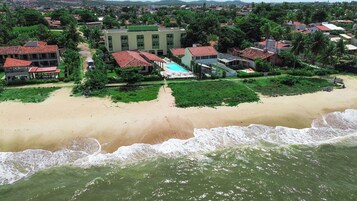 On the beach, white sand, free beach cabanas, sun loungers