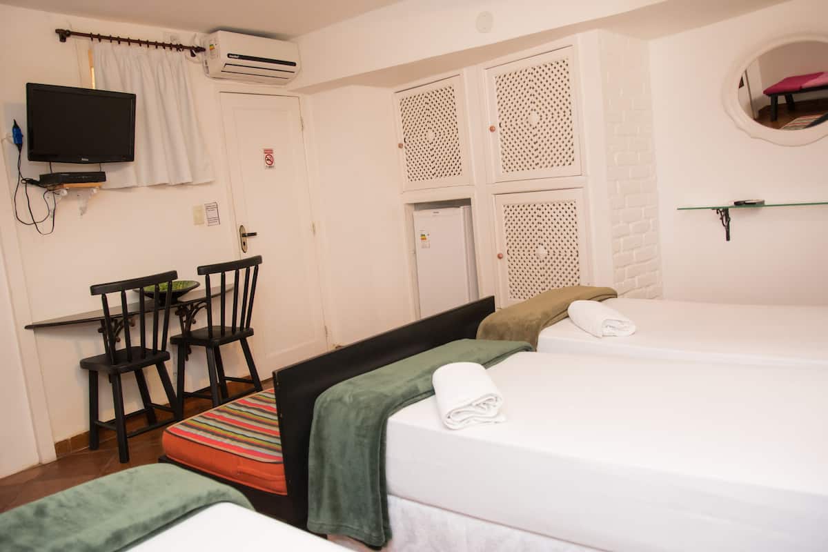 Standard Triple Room | Minibar, in-room safe, blackout curtains