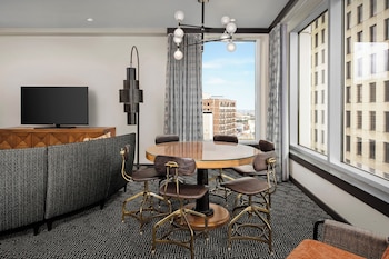 Suite, 1 King Bed, City View | Living area | 42-inch flat-screen TV with premium channels, TV at The Troubadour Hotel New Orleans