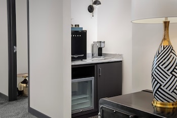 Suite, 1 King Bed, City View | Living area | 42-inch flat-screen TV with premium channels, TV at The Troubadour Hotel New Orleans