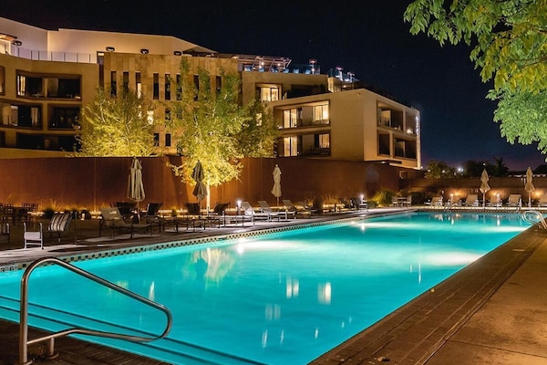 Outdoor pool, open 7:00 AM to 11:00 PM, pool loungers