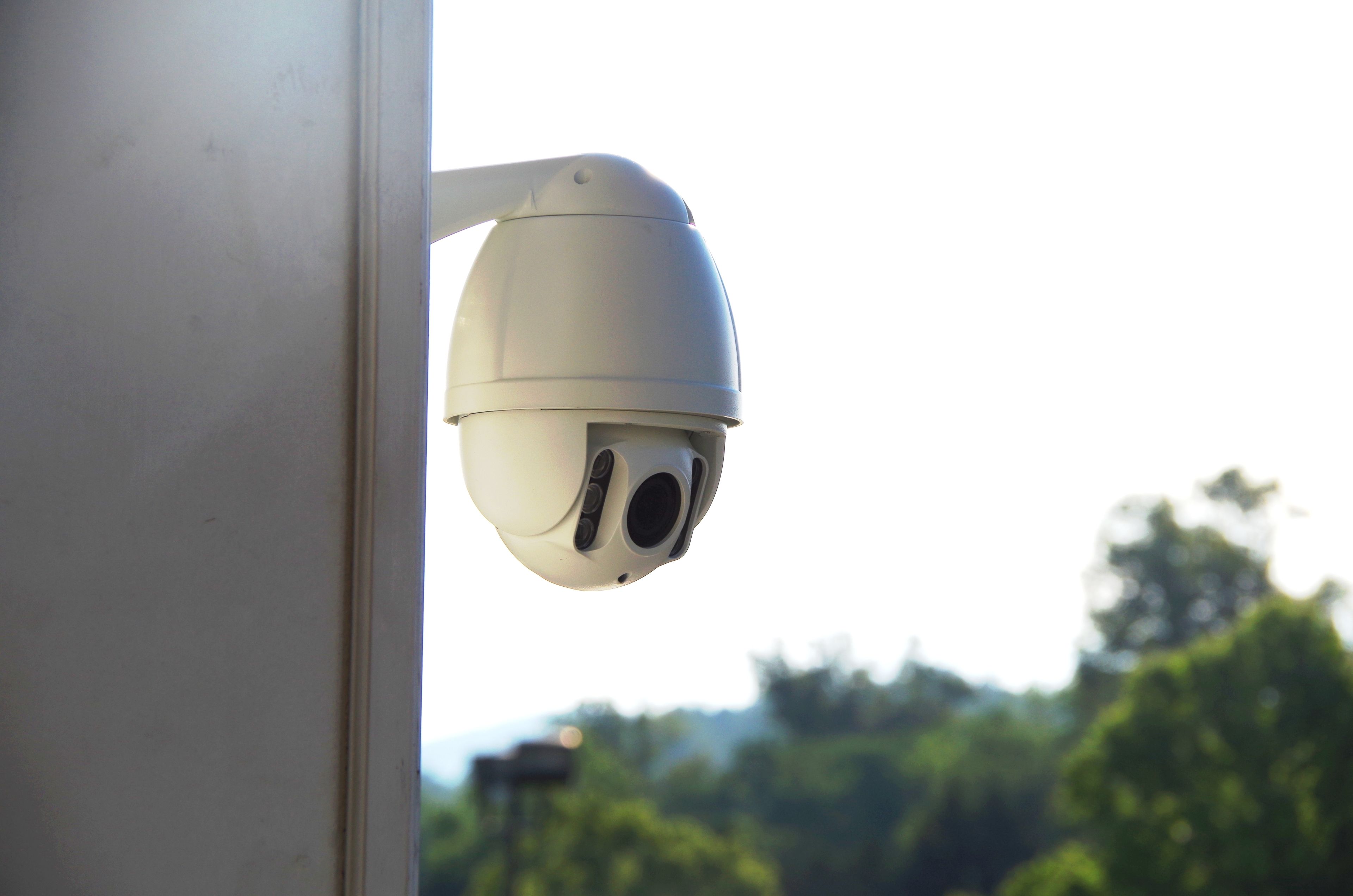 A security camera mounted on a wall.