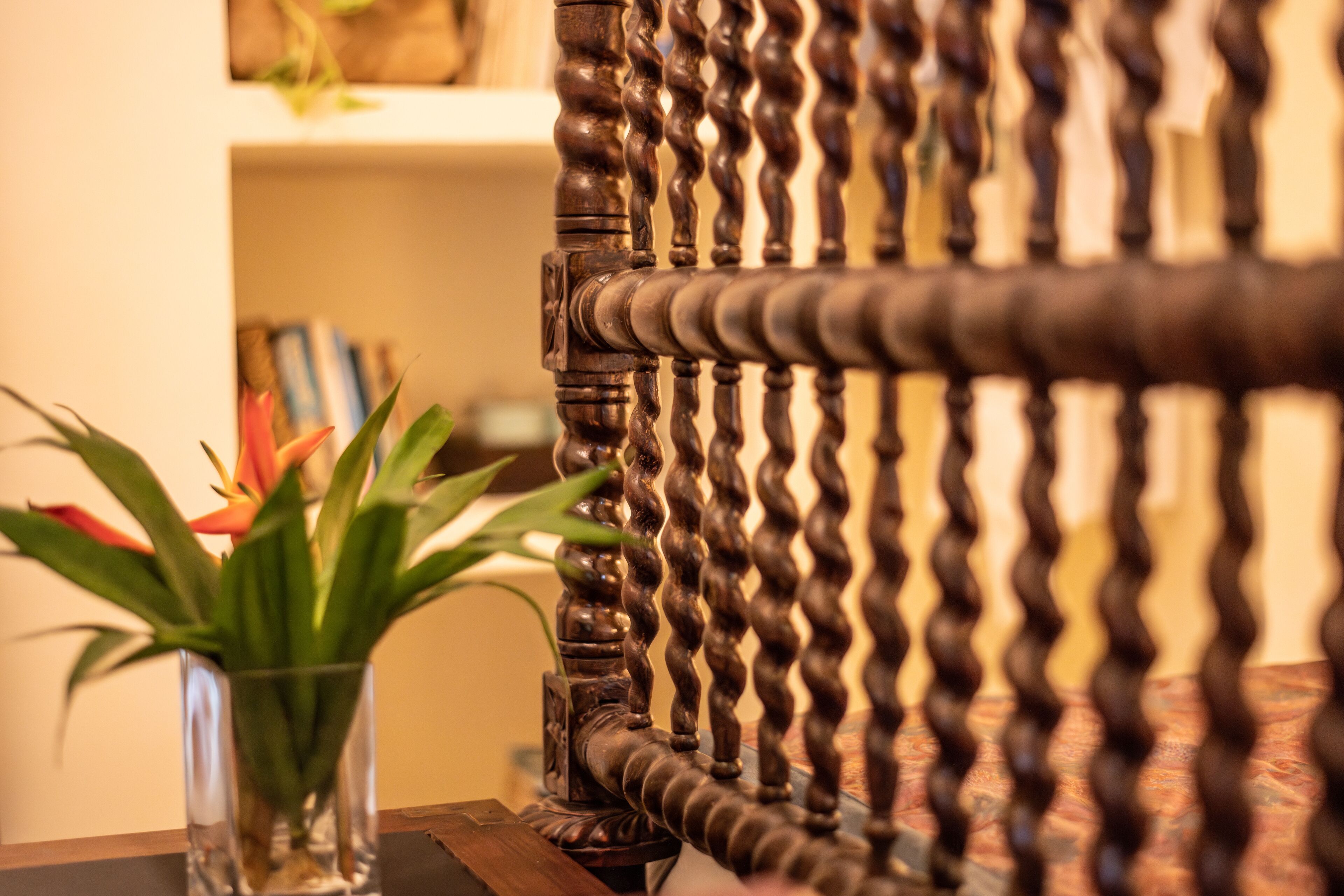 A close-up of a wooden chair with a twisted design.