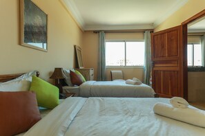 1 bedroom, premium bedding, blackout curtains, iron/ironing board