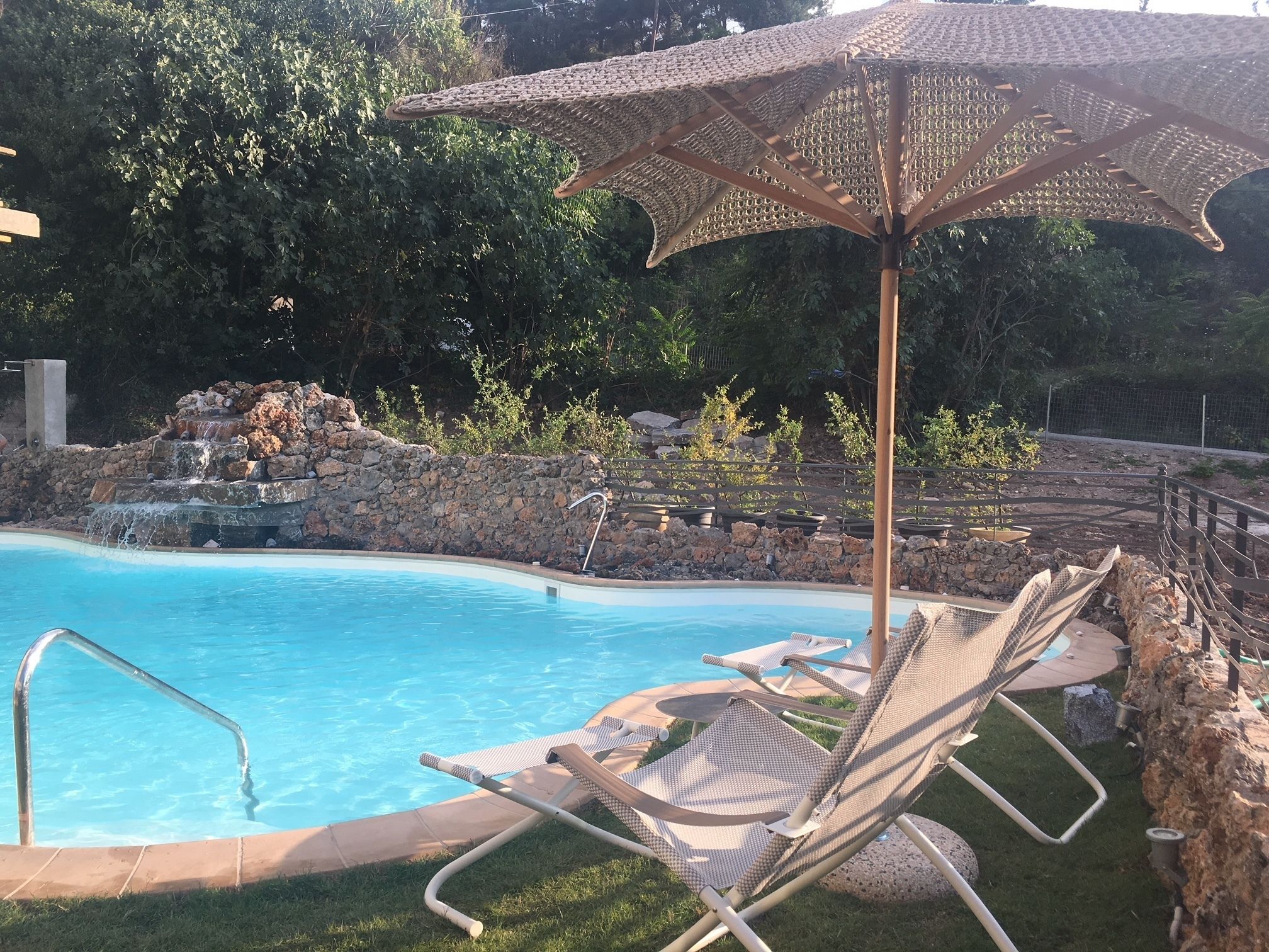 outdoor pool, open 11:00 am to 7:00 pm, pool umbrellas, pool loungers