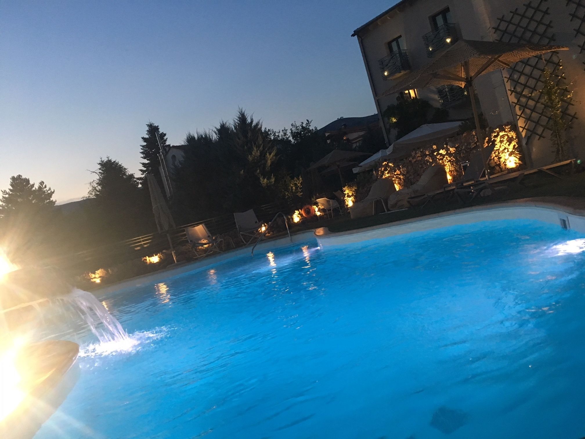 outdoor pool, open 11:00 am to 7:00 pm, pool umbrellas, pool loungers