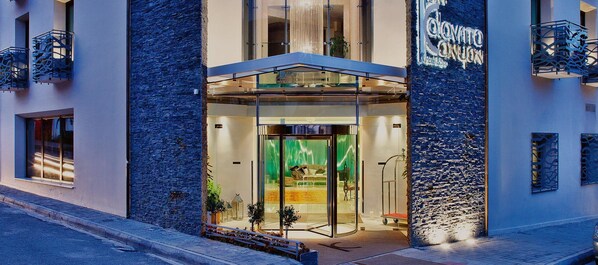 A hotel entrance with a glass door, a stone facade, and a sign reading "Colovito Convento." - Kalavrita Canyon Hotel & Spa (Kalavrita)