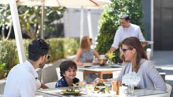 Guests can dine al fresco amidst lush surroundings.