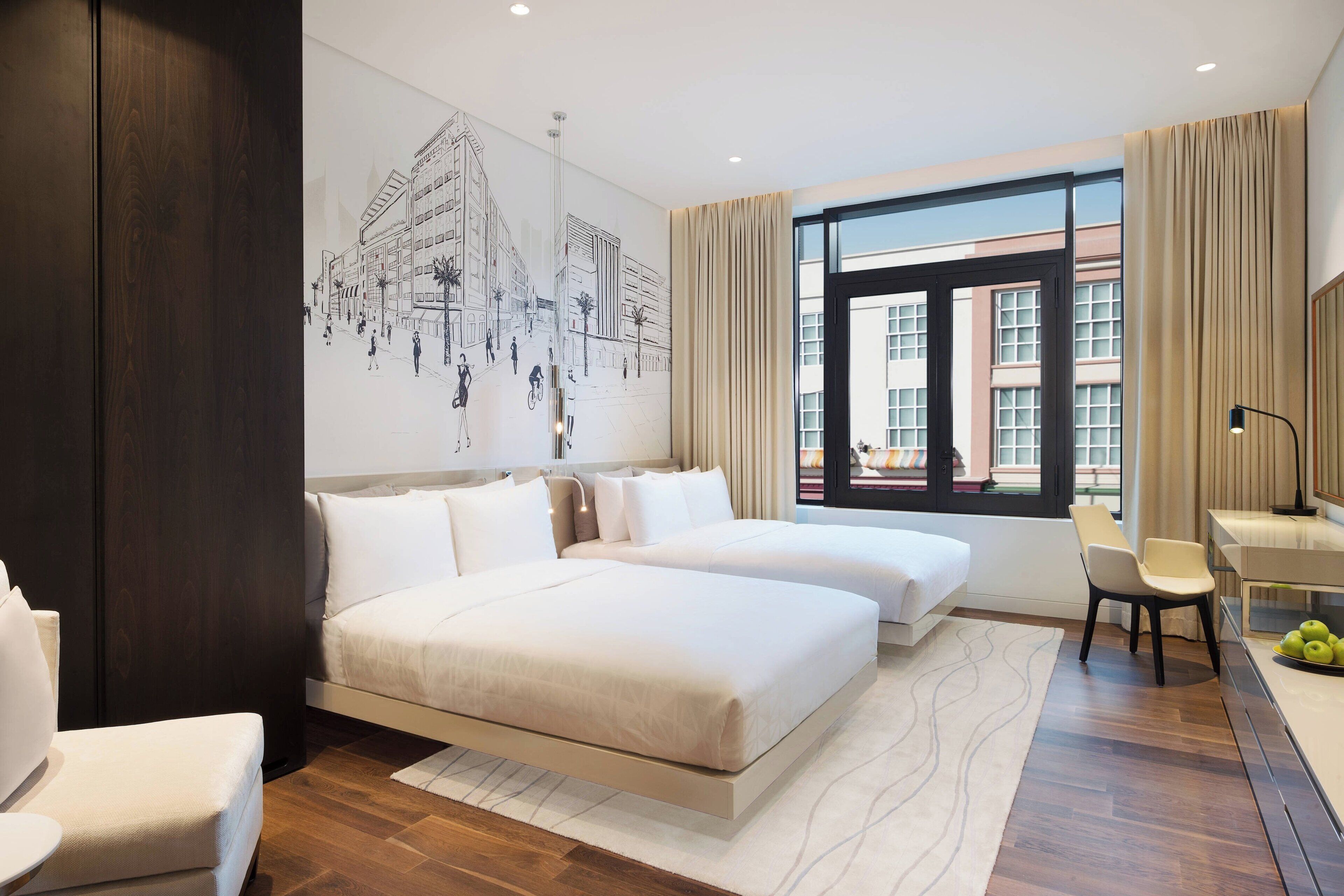 A modern hotel room with two beds, a desk, and a large window.
