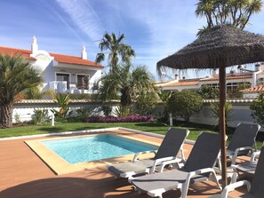 Outdoor pool, open 10:00 AM to 6:00 PM, pool umbrellas, pool loungers