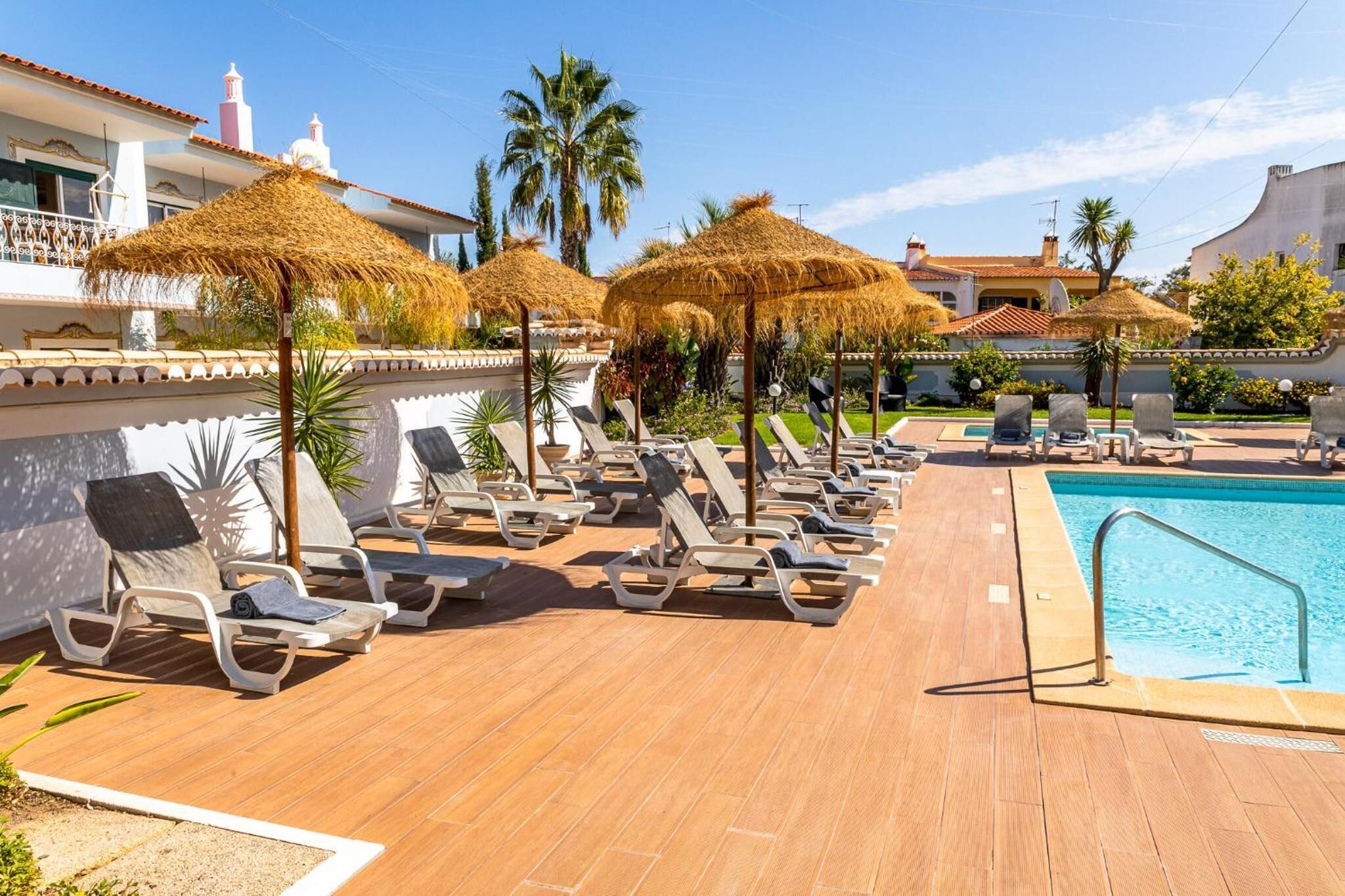 outdoor pool, open 10:00 am to 6:00 pm, pool umbrellas, pool loungers