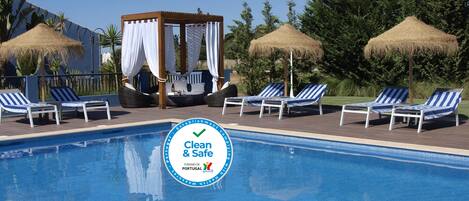 Outdoor pool, pool umbrellas, sun loungers