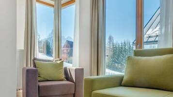 Premium Apartment, Balcony, Courtyard View | Living area | Flat-screen TV
