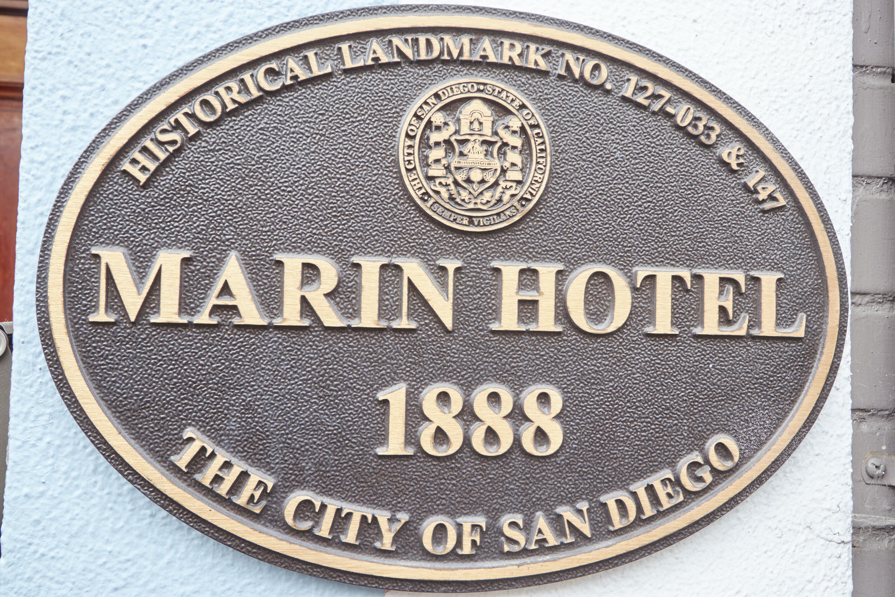 A historical landmark plaque for the Marin Hotel in San Diego, established in 1888.