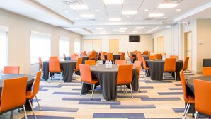 A conference room with multiple tables and chairs, arranged in rows. - Holiday Inn Express & Suites Danville by IHG (Danville)
