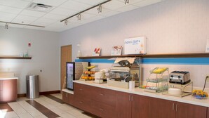 A breakfast bar with a coffee machine, toaster, and fruit display. - Holiday Inn Express & Suites Danville by IHG (Danville)