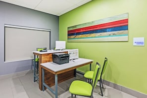 A business center with a desk, printer, computer, and chairs. - Holiday Inn Express & Suites Perryton by IHG (Perryton)
