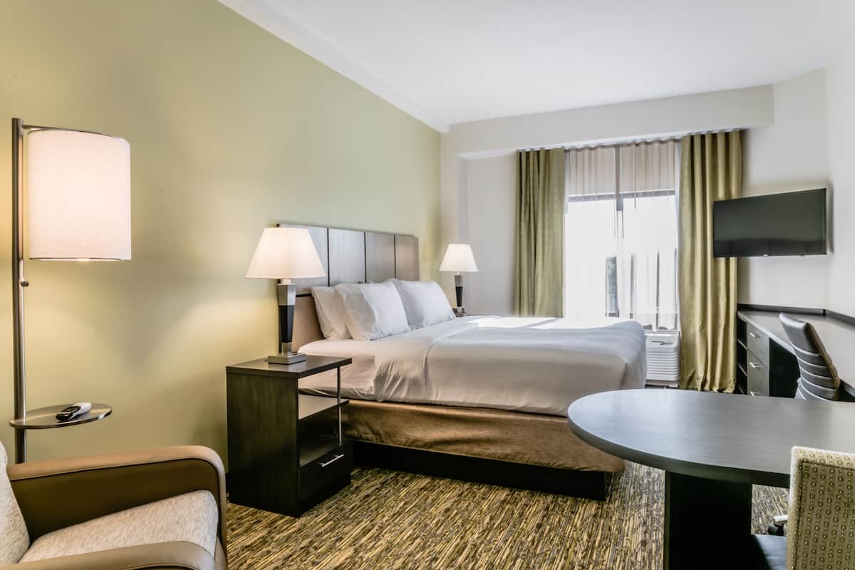 Premium bedding, pillow-top beds, desk, laptop workspace