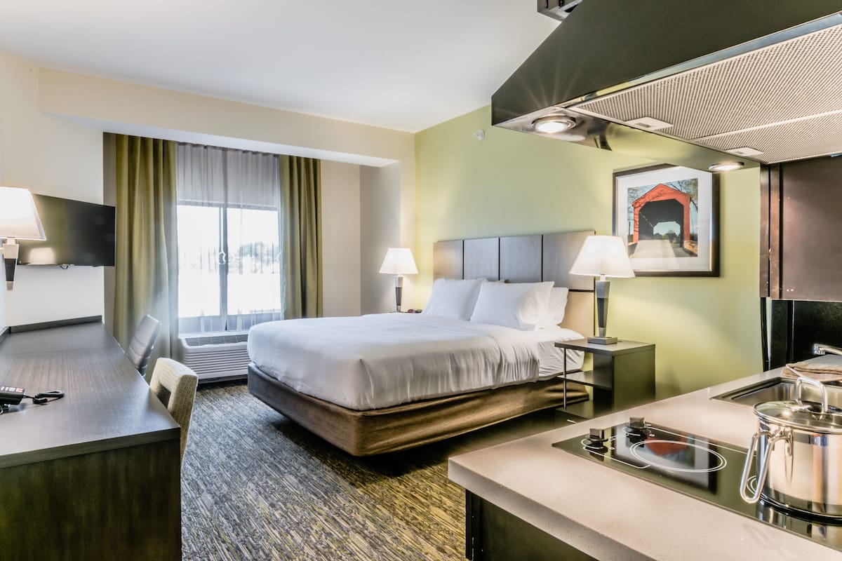 Premium bedding, pillow-top beds, desk, laptop workspace