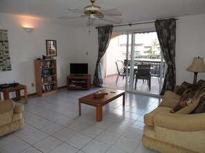 Standard Townhome, 2 Bedrooms, Kitchen | Living room | Flat-screen TV - Villa 230C at Jolly Harbour (Jolly Harbour)
