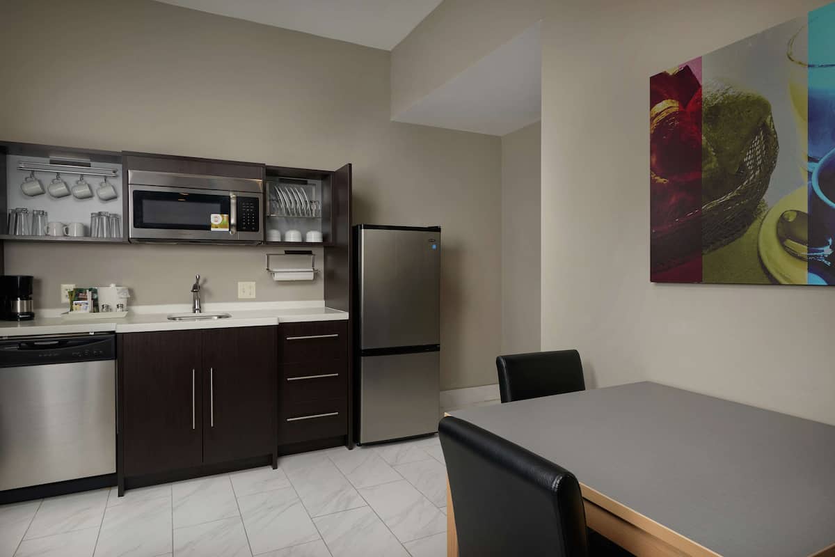 suite, 1 king bed, non smoking | private kitchen | full-sized fridge, microwave, dishwasher, cookware/dishes/utensils