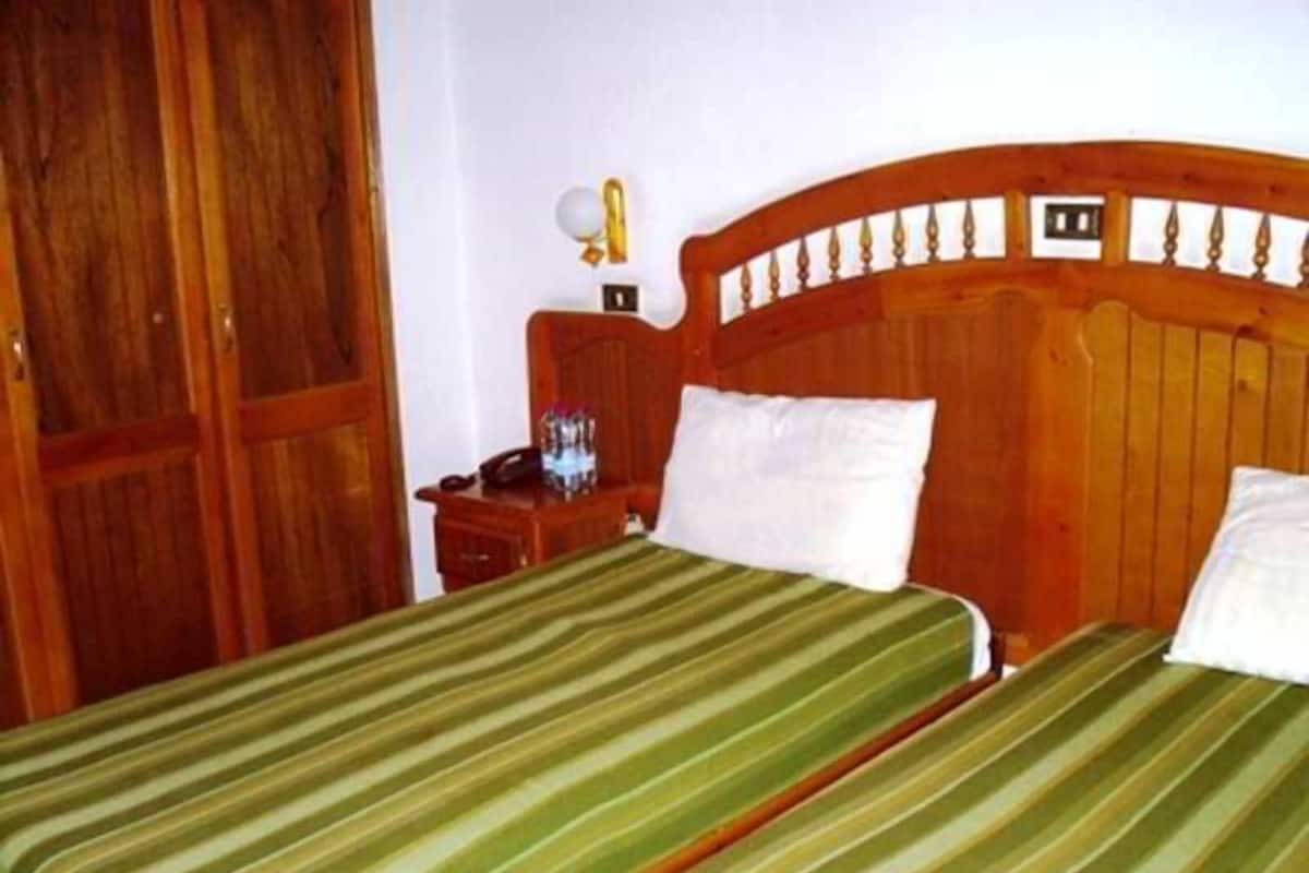 Desk, blackout drapes, WiFi (free), bed sheets