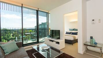 Executive Apartment, 2 Bedrooms, 2 Bathrooms, Park View | Living area | 50-inch flat-screen TV with digital channels, TV, DVD player