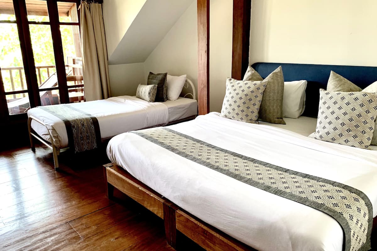 standard triple room, multiple beds, river view | blackout curtains, free wifi, bed sheets