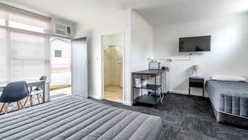Medium Family Room | Desk, blackout curtains, iron/ironing board, free WiFi